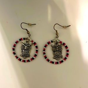 Cute pink, white, and black owl dangling hoop earrings.